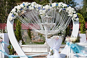 Wedding arch decorated with flowers outdoor