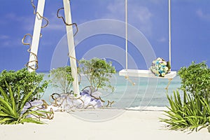 Wedding arch decorated with flowers on tropical beach, outd