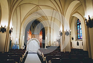 Wedding arch and decoration in interior of Catholic church