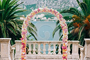 Wedding Arch of hydrangeas and roses. Wedding ceremony in the Ba