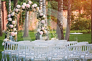 Wedding arch at the outdoor wedding ceremony