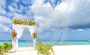 Wedding arch and set up on beach, tropical outdoor wedding