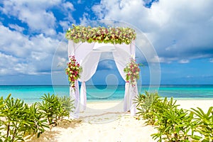 Wedding arch and set up on beach, tropical outdoor wedding