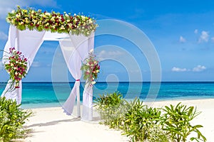 Wedding arch and set up on beach, tropical outdoor wedding