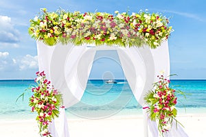 Wedding arch and set up on beach, tropical outdoor wedding