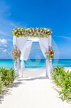 Wedding arch and set up on beach, tropical outdoor wedding