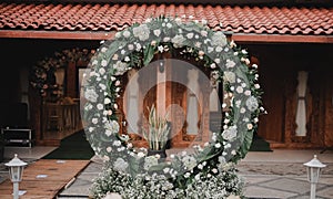 Wedding arch at a venue. Round floral arch.