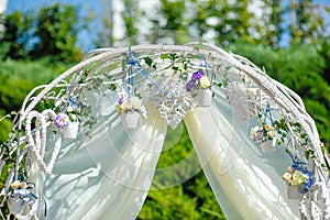 Wedding archway with flowers arranged for a wedding ceremony