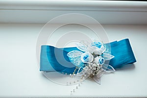 Wedding background with blue bridal garter on the