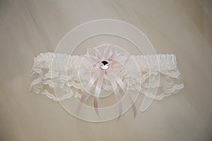 Wedding background with bridal garter