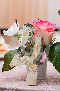 Wedding. Banquet. Flowers. The composition of red, white and green, standing on a table in the area of wedding party.