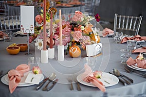 Wedding banquet table with glassware, flowers and candles