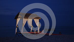 Wedding beach set up for seaside. Wedding arch on the shore of the Indian Ocean decorated with flowers. Holiday concept