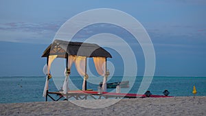 Wedding beach set up for seaside. Wedding arch on the shore of the Indian Ocean decorated with flowers. Holiday concept