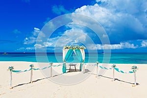 Wedding on the beach . Wedding arch decorated with flowers on tr