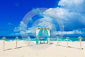 Wedding on the beach . Wedding arch decorated with flowers on tr