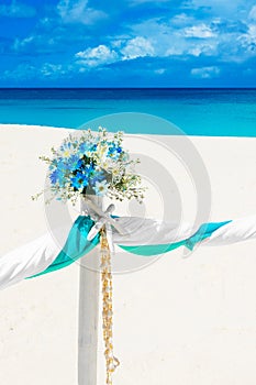 Wedding on the beach . Wedding arch decorated with flowers on tr