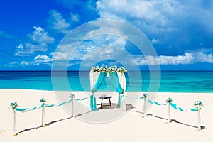 Wedding on the beach . Wedding arch decorated with flowers on tr