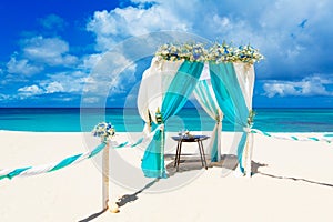 Wedding on the beach . Wedding arch decorated with flowers on tr