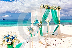 Wedding on the beach . Wedding arch decorated with flowers on tr