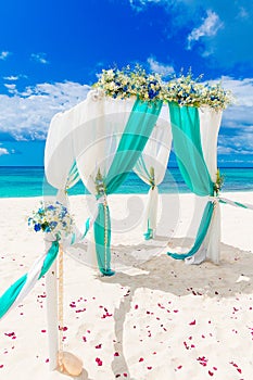 Wedding on the beach . Wedding arch decorated with flowers on tr