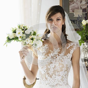 Wedding, beautiful young bride with bouquet