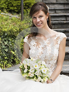 Wedding, beautiful young bride with bouquet