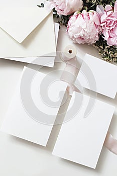 Wedding, birthday stationery mock-up scene. Blank greeting cards, invitations. Decorative floral composition. Closeup of