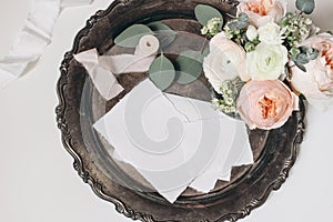 Wedding, birthday stationery still life. Bouquet of pink English roses, Ranunculus and Astrantia flowers , eucalyptus