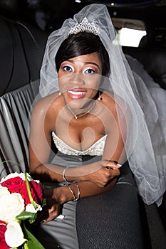 Wedding black american bride lying on luxury limousine