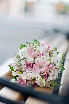 Wedding bouquet on banch. White and pink flowers. Marriage