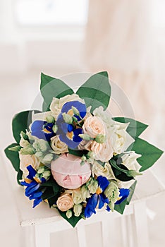 Wedding bouquet with blue flowers. Bouquet for the bride. Flowers for a beautiful woman