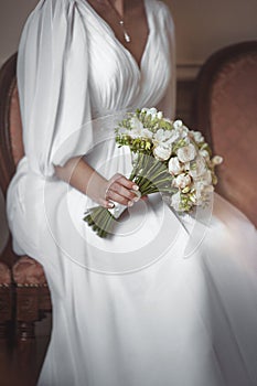 Wedding bouquet of the bride in hand