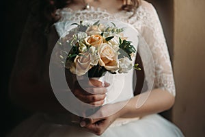 Wedding bouquet of the bride in hand