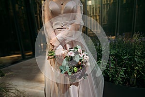 Wedding bouquet of the bride in hand