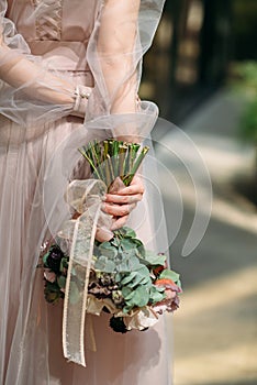 Wedding bouquet of the bride in hand