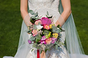 Wedding bouquet in bride hands closeup