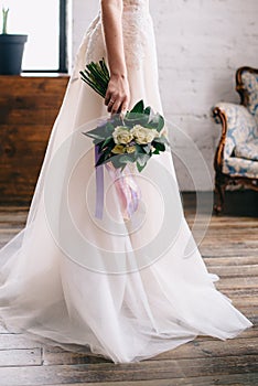 Wedding bouquet in the bride`s hand