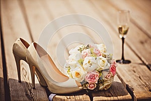 Wedding bouquet and bride shoes