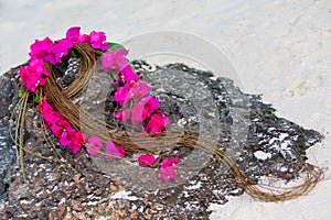 Wedding bouquet of the bride on a tropical beach .
