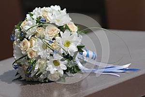 Wedding bouquet cream roses and chamomile