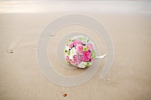 Wedding bouquet flower on beautiful sand beach