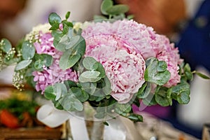 Wedding bouquet of flowers of pink peony. The concept is a holid