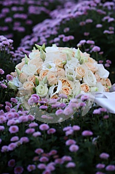 Wedding bouquet on flowery meadow