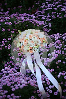 Wedding bouquet on flowery meadow