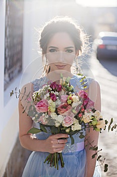 Wedding bouquet in girl`s hands.