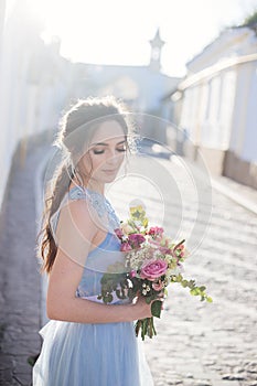 Wedding bouquet in girl`s hands.