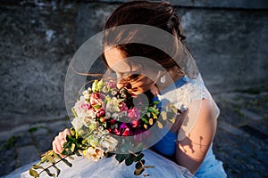 Wedding bouquet in girl`s hands.