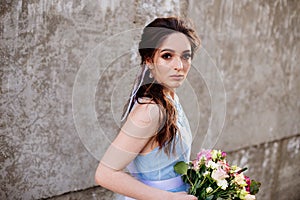 Wedding bouquet in girl`s hands.