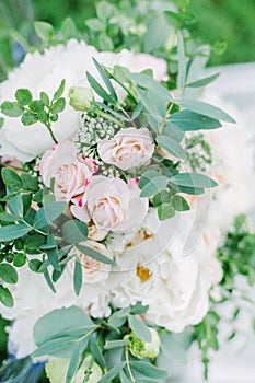 Wedding bouquet on the glass chair, outdoor, fine art.